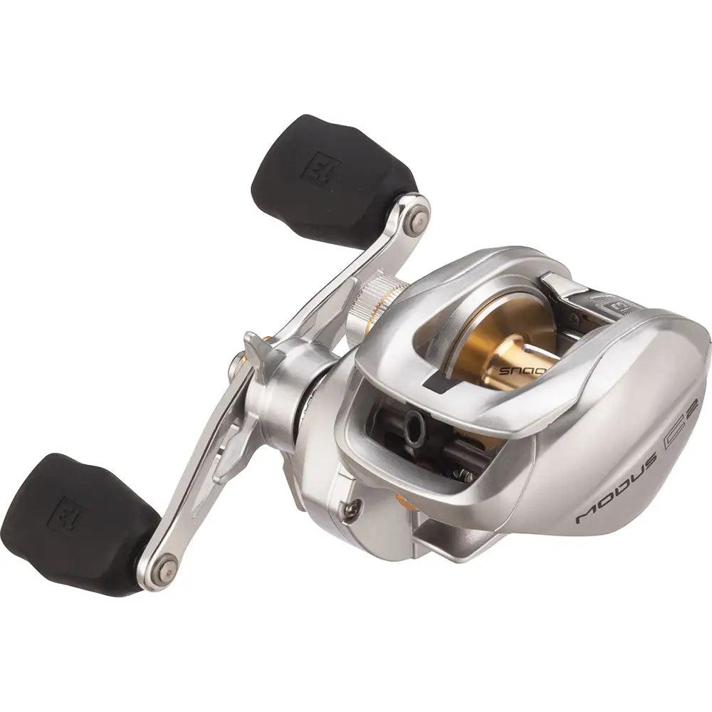 Silver and black baitcasting fishing reel with gold spool and modus cr engraving, ideal for bergen performance marine boat gear.